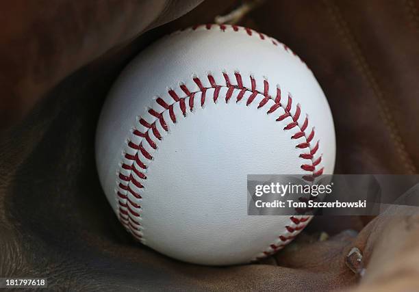 Baseball inside the catcher's glove of Chris Snyder of the Baltimore Orioles before the start of MLB game action against the Toronto Blue Jays on...