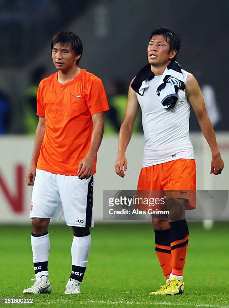 Takashi Inui of Frankfurt and Yusuke Tasaka of Bochum chat after the DFB Cup second round match between Eintracht Frankfurt and VfL Bochum at...