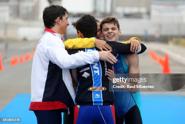 Nicolas Girard of Argentina completes the running stage and celebrates with teammates Eduardo Londoo Naranjo of Colombia, Alexander Miller of...