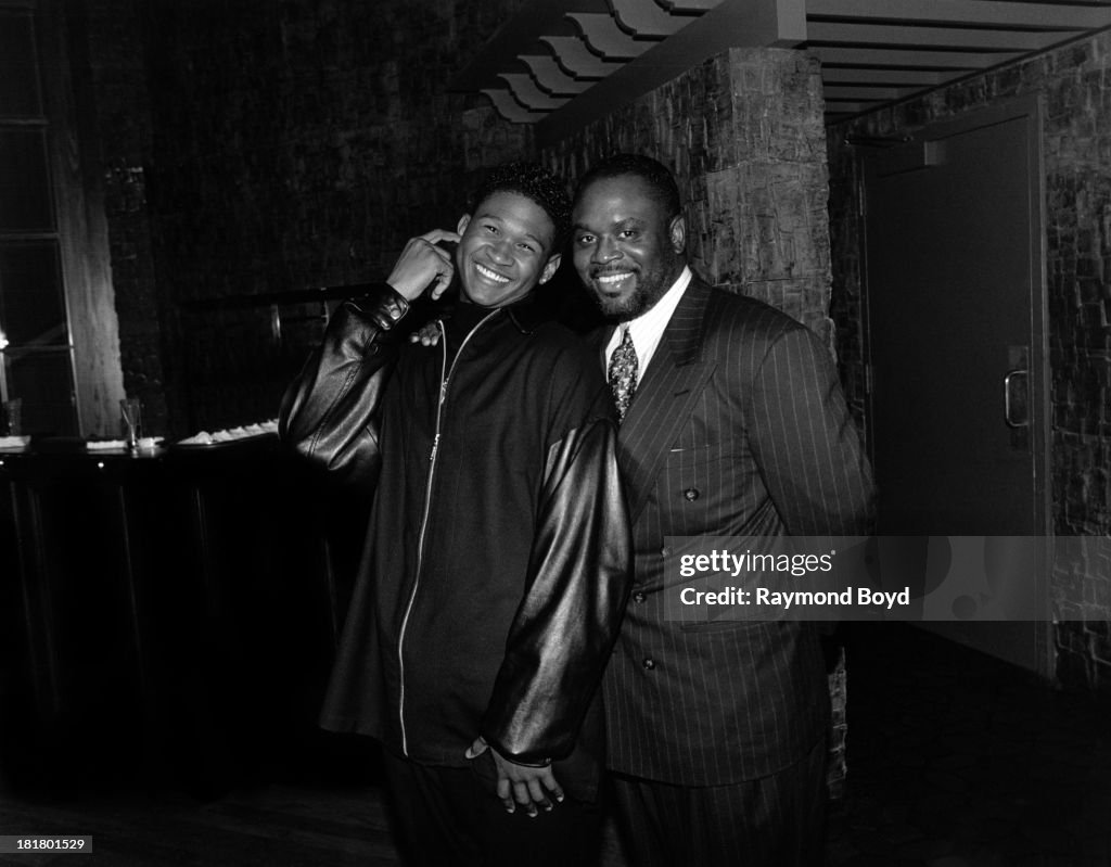 Usher Rabinowitz Singer Usher poses for photos with record executive L.A. Reid, at the ...