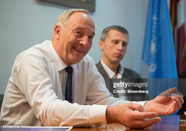 Andris Berzins, president of Latvia, left, speaks during an interview at the Latvian Mission in New York, U.S., on Wednesday, Sept. 25, 2013. Berzins...