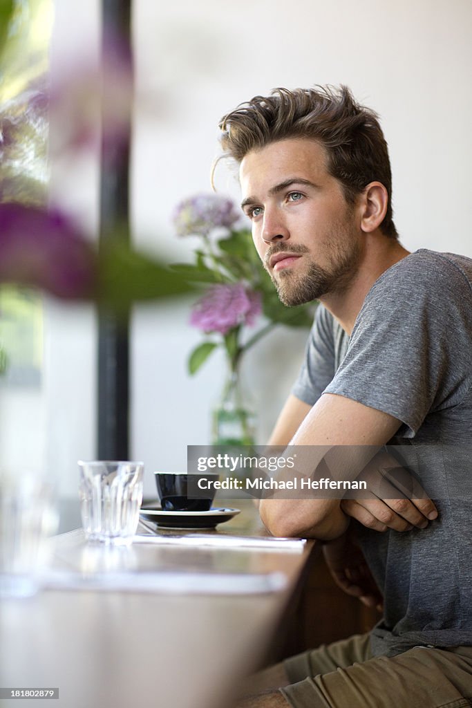 Portrait of young man in cafe