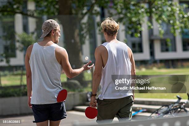 two men playing table tennis - friends table tennis stock pictures, royalty-free photos & images