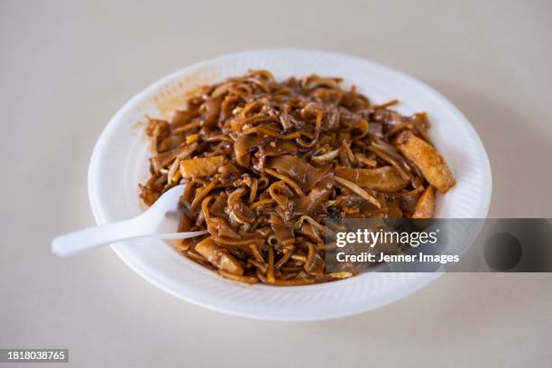 char kway teow in a singapore hawker market. - char kway teow stock pictures, royalty-free photos & images