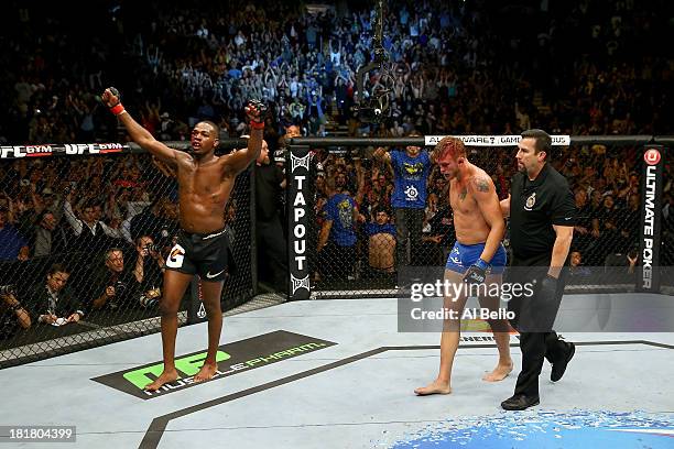 Jon 'Bones' Jones celebrates after finishing five rounds against Alexander 'The Mauler' Gustafsson in their UFC light heavyweight championship bout...