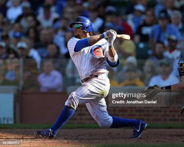 Darnell McDonald of the Chicago Cubs hits a three-run home run in the 6th inning against the Pittsburgh Pirates at Wrigley Field on September 25,...
