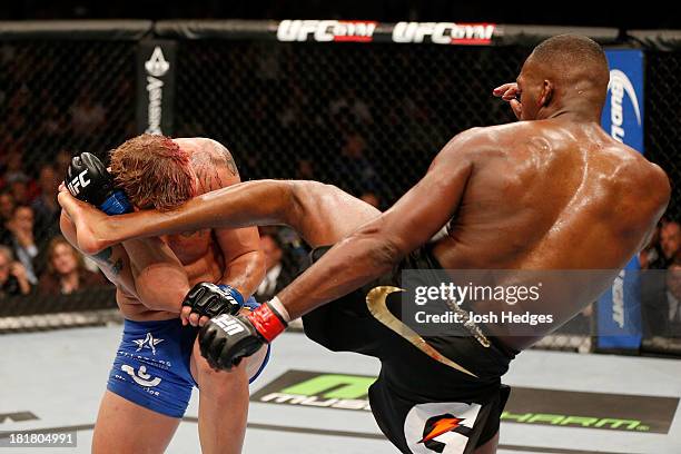 Jon 'Bones' Jones kicks Alexander 'The Mauler' Gustafsson in their UFC light heavyweight championship bout at the Air Canada Center on September 21,...