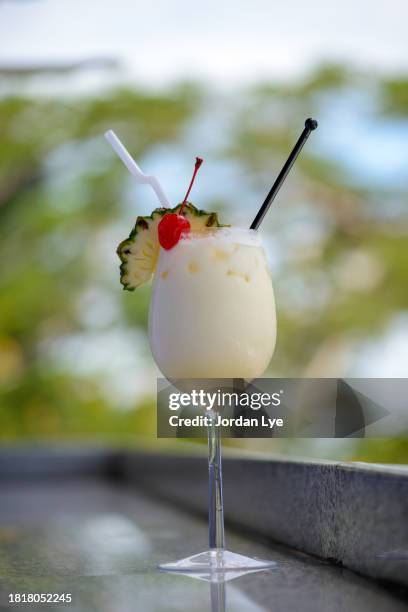 pina colada with pineapple and cherry on top - pina colada stock pictures, royalty-free photos & images