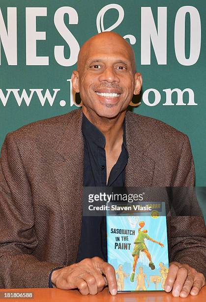 Basketball legend Kareem Abdul-Jabbar signs copies of his book "Sasquatch In Paint" at Barnes & Noble, 5th Avenue on September 25, 2013 in New York...