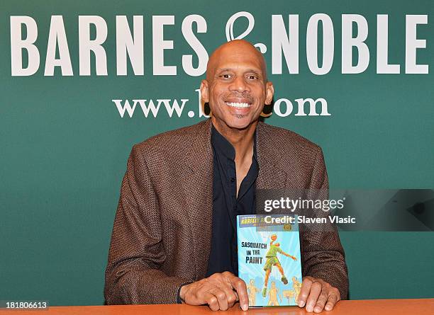 Basketball legend Kareem Abdul-Jabbar signs copies of his book "Sasquatch In Paint" at Barnes & Noble, 5th Avenue on September 25, 2013 in New York...