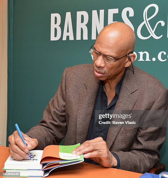 Basketball legend Kareem Abdul-Jabbar signs copies of his book "Sasquatch In Paint" at Barnes & Noble, 5th Avenue on September 25, 2013 in New York...