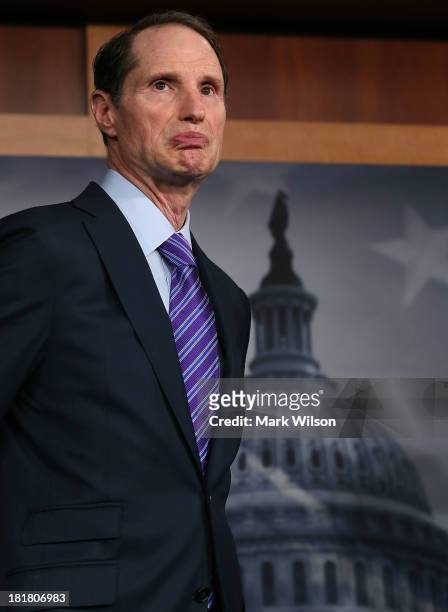 Sen. Ron Wyden listens to questions during a news conference on Capitol Hill September 25, 2013 in Washington, DC. A bipartisan group of Senators...