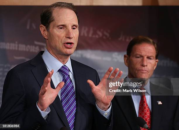 Sen. Ron Wyden speaks while flanked by U.S. Sen. Richard Blumenthal during a news conference on Capitol Hill September 25, 2013 in Washington, DC....