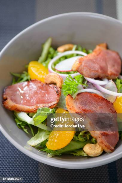 salad with pieces of duck meat and vegetables - cashew pieces stock pictures, royalty-free photos & images