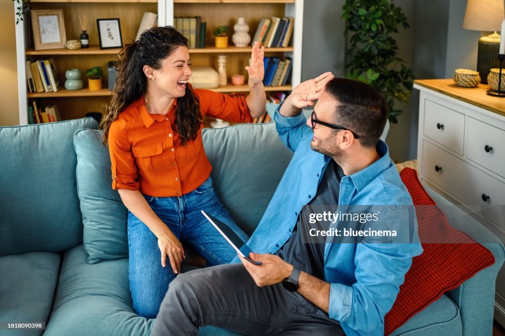Happy couple sharing a high five