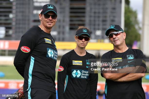 Heat coching staff look on prior to the bat flip during The Eliminator WBBL finals match between Brisbane Heat and Sydney Thunder at WACA, on...