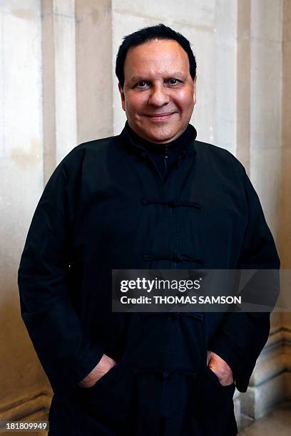 French fashion designer Azzedine Alaia poses at the launching of his exhibition "Alaia" at the Galliera Palace in Paris on September 25, 2013. AFP...