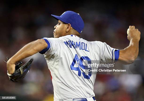 Relief pitcher Carlos Marmol of the Los Angeles Dodgers pitches against the Arizona Diamondbacks during the MLB game at Chase Field on September 18,...