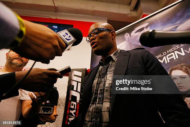 Mixed martial artist Anderson Silva of Brazil speaks to the media prior to a autograph signing at UFC Gym on September 25, 2013 in New York City.