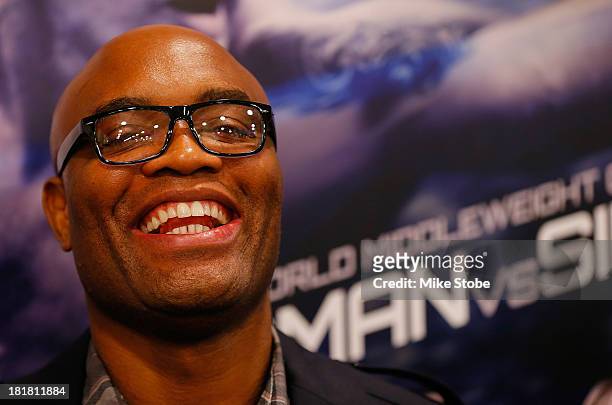 Mixed martial artist Anderson Silva of Brazil speaks to the media prior to a autograph signing at UFC Gym on September 25, 2013 in New York City.