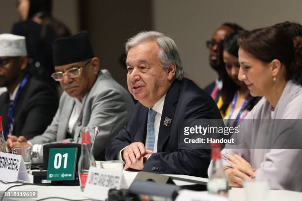 In this handout image suppled by COP28, António Guterres, Secretary-General of the United Nations attends the event 'Delivering Early Warnings For...