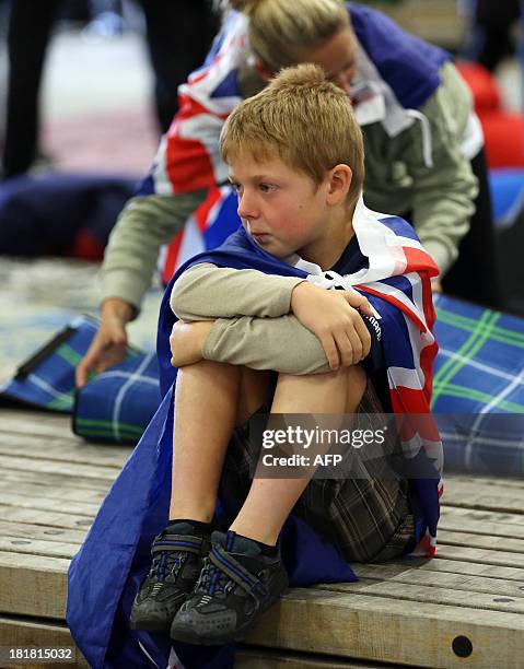 Fans of Team New Zealand show their support as they watch racing in the America's Cup at a venue set up in downtown Auckland with large television...