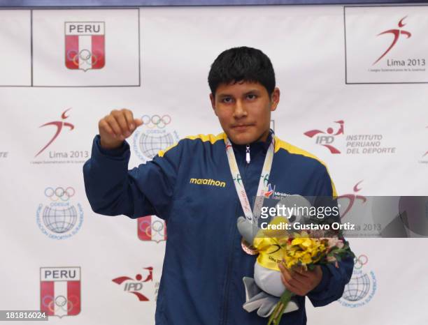 Gibson Rios of Ecuador in the podium of Boxing 56kg as part of the I ODESUR South American Youth Games at Coliseo Miguel Grau on September 25, 2013...