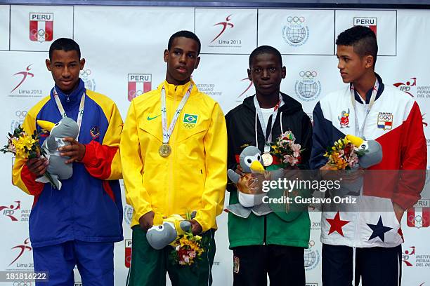 Carlos Santos of Brazil , Jose Zarraga of Venezuela Rafael Pedroza of Panama and Tefon Greene of Guayana in the podium of Boxing 49kg category as...