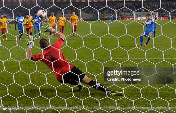 Jelle Vossen of Krc Genk - Miguel Santos Pravos goalkeeper of AFC Tubize in action during the Cofidis Cup match between KRC Genk and AFC Tubize on...