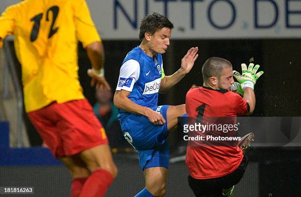 Jelle Vossen of Krc Genk - Miguel Santos Pravos goalkeeper of AFC Tubize in action during the Cofidis Cup match between KRC Genk and AFC Tubize on...