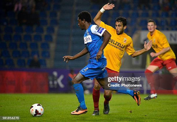 Steven Joseph Monrose of Krc Genk - Sofian Kheyari of AFC Tubize in action during the Cofidis Cup match between KRC Genk and AFC Tubize on September...