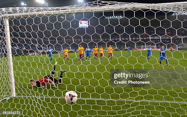 Jelle Vossen of Krc Genk - Miguel Santos Pravos goalkeeper of AFC Tubize in action during the Cofidis Cup match between KRC Genk and AFC Tubize on...