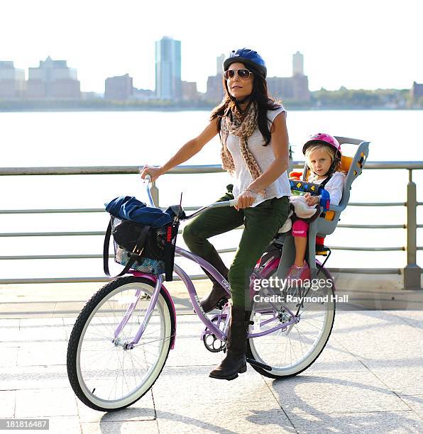 Bethenny Frankel and Bryn Hoppy are seen biking on the West Side Highway on September 25, 2013 in New York City.