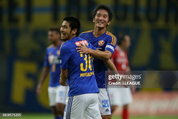 Hidetaka Kanazono and Kazuhiro Murakami of Vegalta Sendai celebrate the team's 1-0 victory in the J.League J1 second stage match between Nagoya...