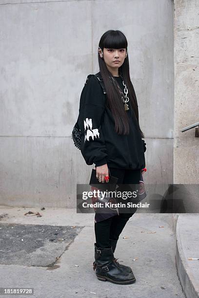 Kozue Akimoto wears a Been Trill top, Monki jeans, Red wing boots and an Ambush necklace on day 2 of Paris Fashion Week Spring/Summer 2014, Paris...