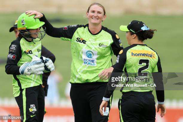 Sammy-Jo Johnson of the Thunder celebrates after taking the wicket of Amelia Kerr of the Heat during The Eliminator WBBL finals match between...