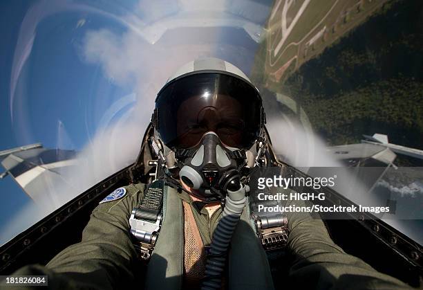 andersen air force base, guam, february 6, 2013 - view from the cockpit of an f-16 block 30 pulling g's in the overhead break during cope north 2013 exercises. - us air force pilot stock pictures, royalty-free photos & images