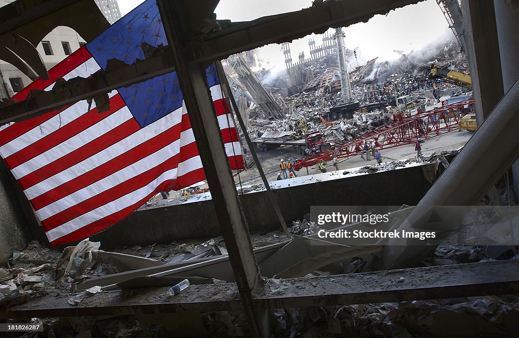 The American Flag is prominent amongst the rubble of what was once the World Trade Center.