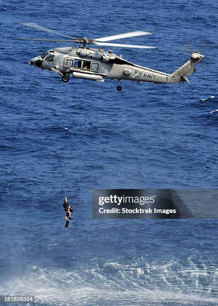 Navy Rescue 18 Us Navy Air Rescue Swimmers Stock Photos, High-Res Pictures, and ...