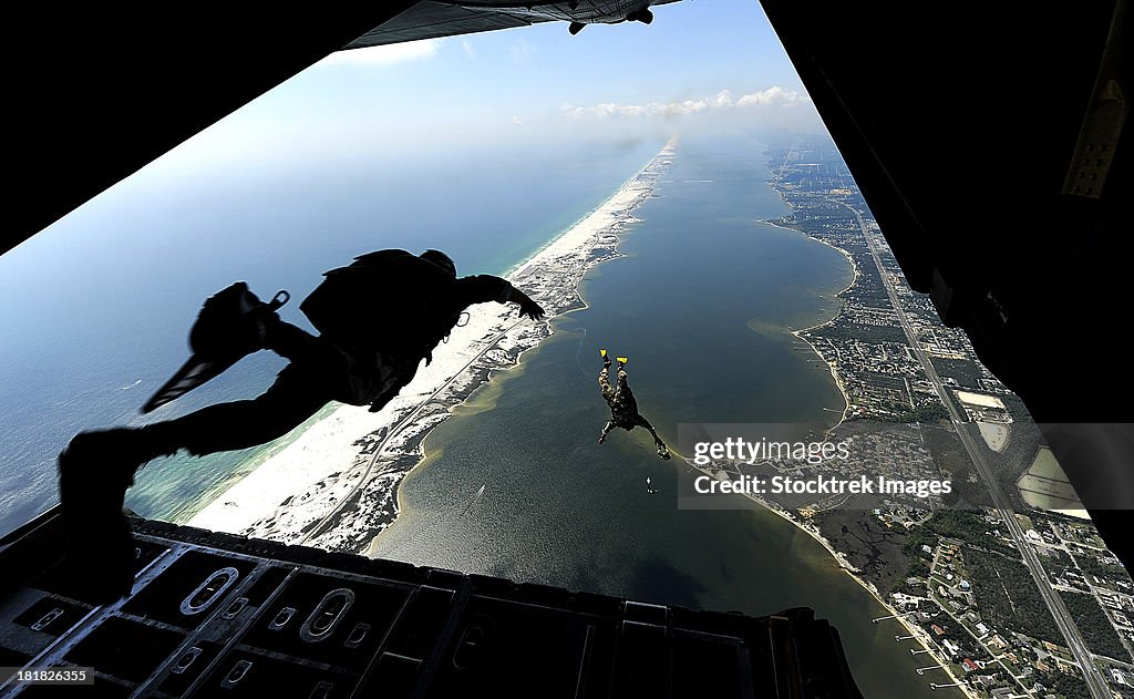 September 27, 2010 - U.S. Airmen jump out of a C-130 Hercules aircraft during parachute training at Santa Rosa Sound, Florida.