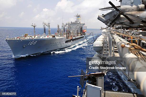 the military sealift command fleet replenishment oiler usns joshua humphreys refuels uss boxer. - gulf of aden stock pictures, royalty-free photos & images