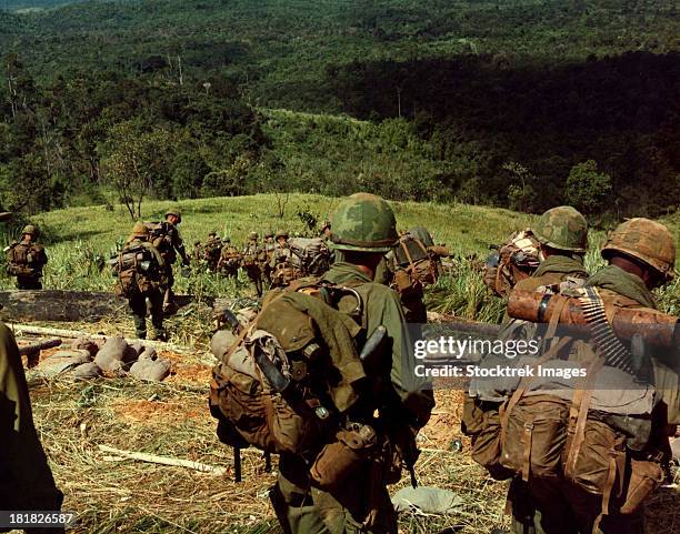 november 14-17, 1967 - soldiers descend the side of hill 742, located five miles northwest of dak to, vietnam.  - vietnam war 1967 stock pictures, royalty-free photos & images