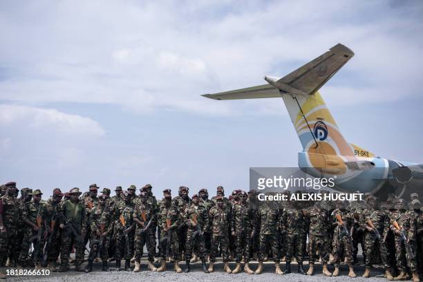 Kenyan soldiers from the East African Community regional force prepare to leave the Democratic Republic of Congo, at Goma airport, on December 3,...