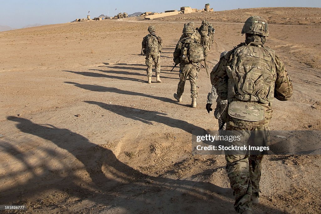U.S. Army soldiers walk toward a checkpoint in Afghanistan.
