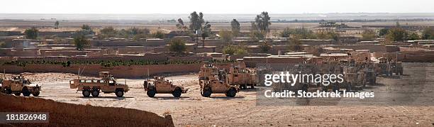 november 2, 2011 - military vehicles parked outside loy karez, kandahar province, afghanistan. - afghanistan war stock pictures, royalty-free photos & images