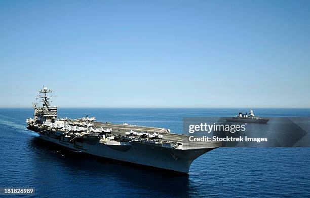 uss harry s. truman cruises alongside the german navy frigate fgs hessen. - uss harry s truman stock pictures, royalty-free photos & images