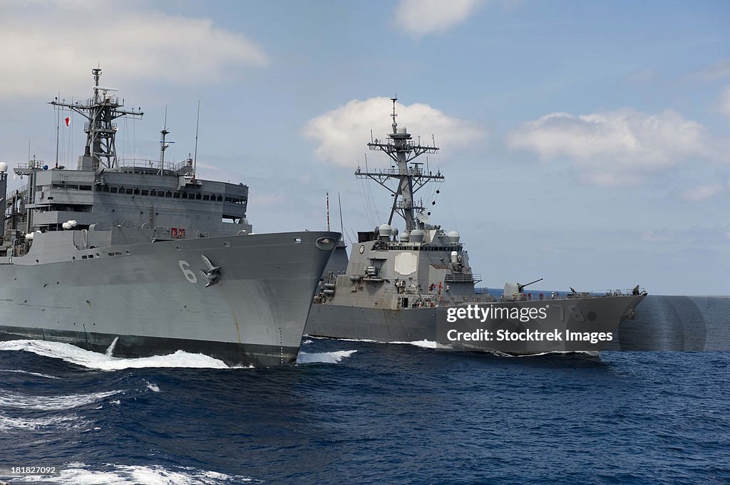 USNS Supply conducts a replenishment at sea with USS Porter.