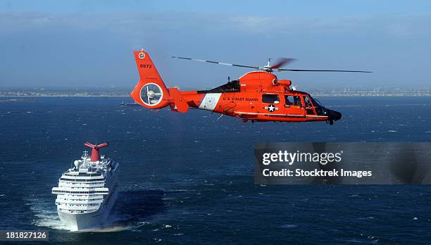 a mh-65c dolphin helicopter off the coast of san pedro, california. - coast guard stock pictures, royalty-free photos & images