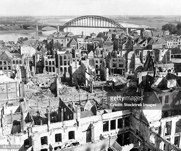 a view of the city of nijmegen, holland, after it was destroyed during wwii. - tweede wereldoorlog stockfoto's en -beelden