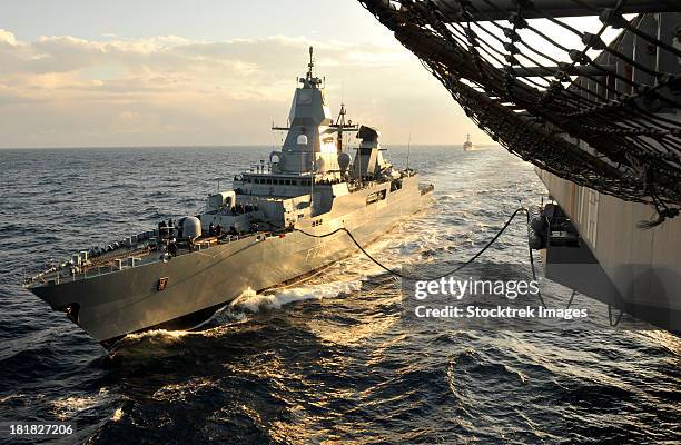 german sachsen-class frigate hessen conducts an underway replenishment. - hesse stockfoto's en -beelden